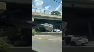 Semi-truck trailer lodged into bridge on I-495 north in Maryland