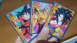 Abrir três pacotinhos de #dragonbollz #dragoballz peguei cartas boas.