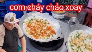 Siêu phẩm ẩm thực đường phố cơm cháy kho quẹt trên chảo xoay