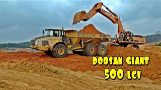 DOOSAN GIANT 500 LCV EXCAVATOR AND TRUCKS VOLVO 6x6