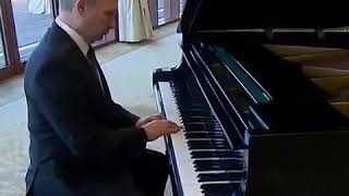 Putin playing a Piano