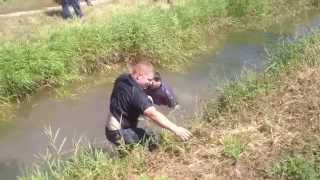 Farmers Fall Short in Canal Jump Attempt