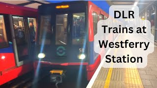 Two Docklands Light Railway trains spotted at Westferry DLR station.