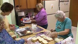 St. James Lutheran Church members pack lunches for homeless