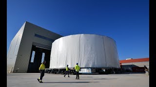 Cocooned Cryostat Lower Cylinder moves into temporary storage