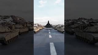 The Sukhoi Su-57 Lands Between a Column of Abrams Tanks