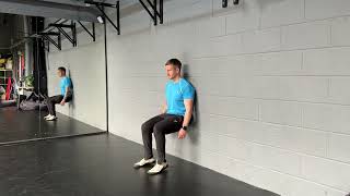 Wall sit iso with heel lift