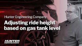 Adjusting vehicle ride height based on gas tank level