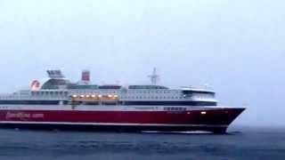 Cruiseferry Stavangerfjord in snow. Near the rock wall