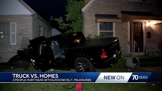 Truck crashes into two homes