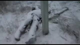 Frozen & chained Russian soldier somewhere in the woods of East Ukraine