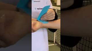 Ace your tennis game by taping your wrists with kinesiology tape! 🎾