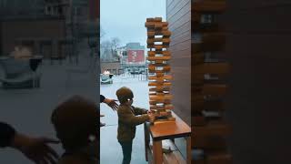 Dad saves son from toppling wooden tower