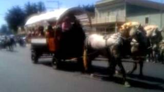 Covered wagon with kazoos playing Ol Suzannah