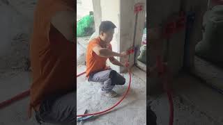 Professional electrical conduit bending techniques by an electrician.