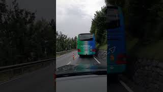 Bus barely making it in Swiss Alps roads