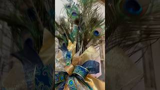 Dress up your tree w these elegant blue ornaments and don’t skip the Showstopper Peacock Tree topper