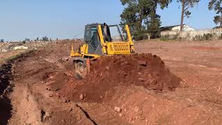 Komatsu D65 dozer pushing dirt