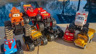 Disney Pixar Cars fall into the water: Lightning McQueen, Mater, Jackson Storm, Natalie Certain