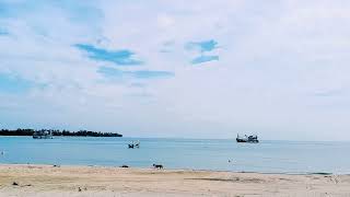 KG SEMANYIR BEACH MERSING. FISHING BOAT COMING IN AND OUT FROM TG. GEMOK PIER. ENDAU MERSING