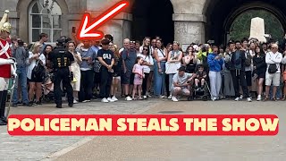 Policeman Steals the Show by Escorting Disabled Lady to the Front.