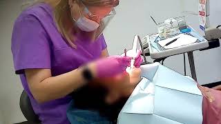 Professional teeth cleaning by dental hygienist / scaling / polish teeth