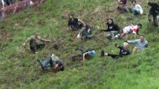 US woman rolls her way to victory in BRUTAL cheese rolling contest in the UK