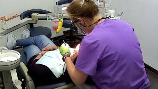 Remove tartar and plaque in dental clinic by dental hygienist