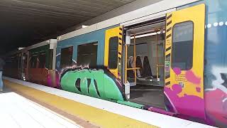 New gold coast NGR 703 Departing Robina station on a Brisbane Airport service on a art livery