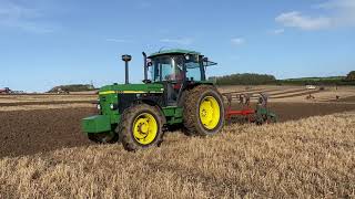 John Deere 3350 working a 4 furrow plough