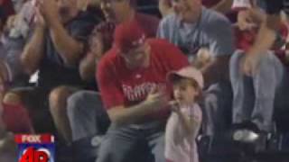 A Phillies fan scooped up a foul ball and gave it to his toddler-- only to watch her throw it right back