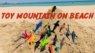 Dinosaur and Sea Creatures Beach Toys....Mountain on Beach...Toy at the Beach for Kids || Kids Video