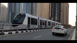 Dubai Tram Crossing Al Braih Street Towards The Marina Sea Front