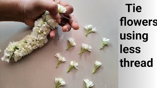 Different method to tie mullai flower/How to string flowers using less amount of thread/veni/garland