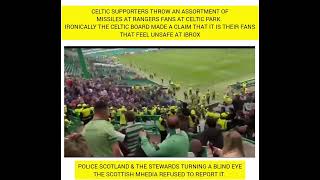 Rangers fans pelted with various objects from the Celtic support at Celtic Park.