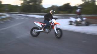 KTM 450 supermoto powerslide drift in traffic circle