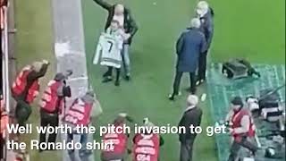 Cristiano Ronaldo gives young fan his shirt and a hug aa she ran onto the pitch